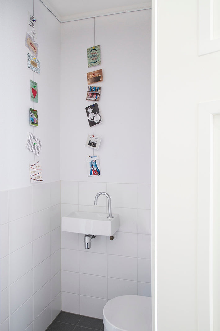 STAS white magnet set helps organize spaces with magnetic photo displays.