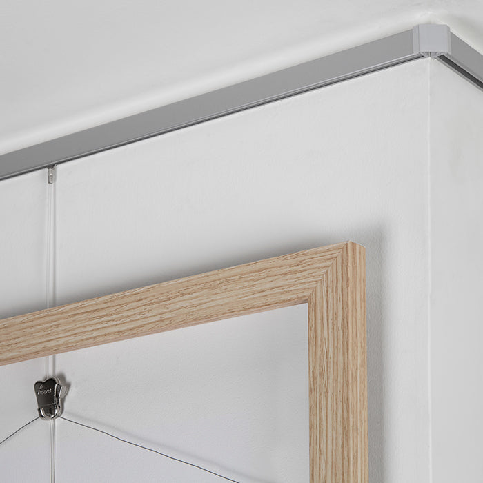 Achieve sleek, invisible displays with STAS minirail picture hanging rail.