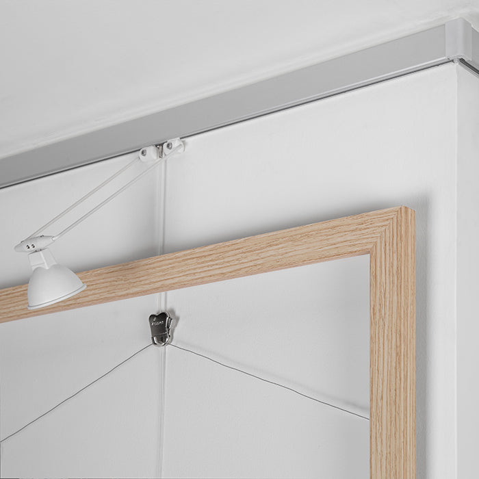 STAS multirail: sleek picture rail hanging solution with lighting for showcasing your pictures.