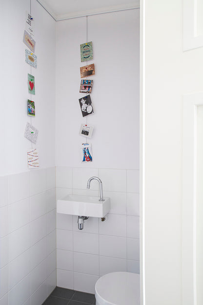 STAS white magnet set helps organize spaces with magnetic photo displays.