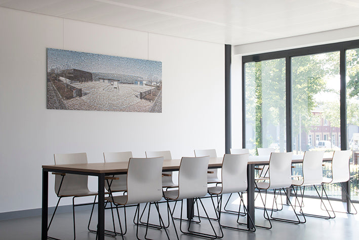 STAS u-rail hanging systems adapt drop ceilings into dynamic art spaces.